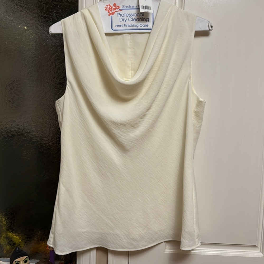 White cowl neck lined top.